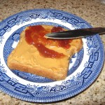 Spread jelly or honey over top of peanut butter